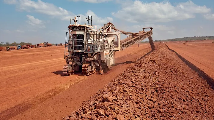 A Wirtgen surface miner extracting bauxite in an open pit mine